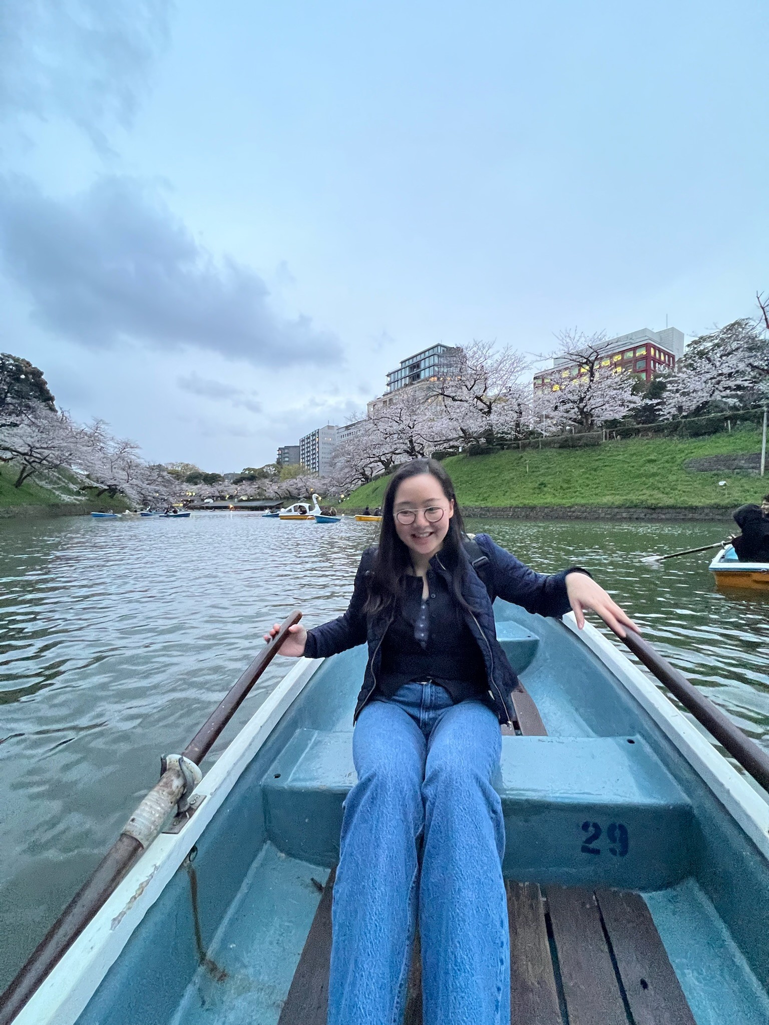 Olivia on a boat during sakura season